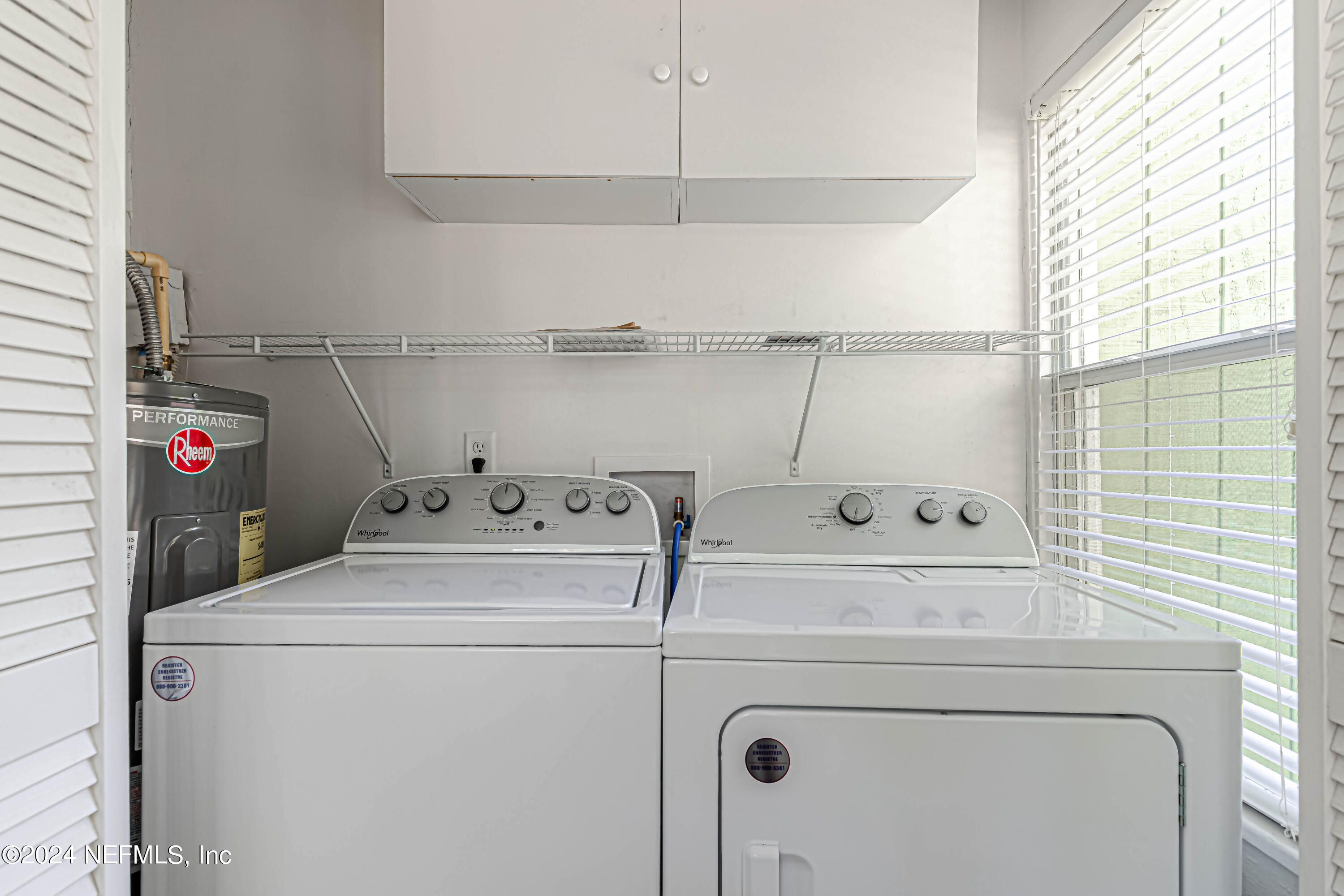 725 Cherokee Street Jacksonville, FL 32205 - Photo 11 of 41 a utility room with dryer and washer