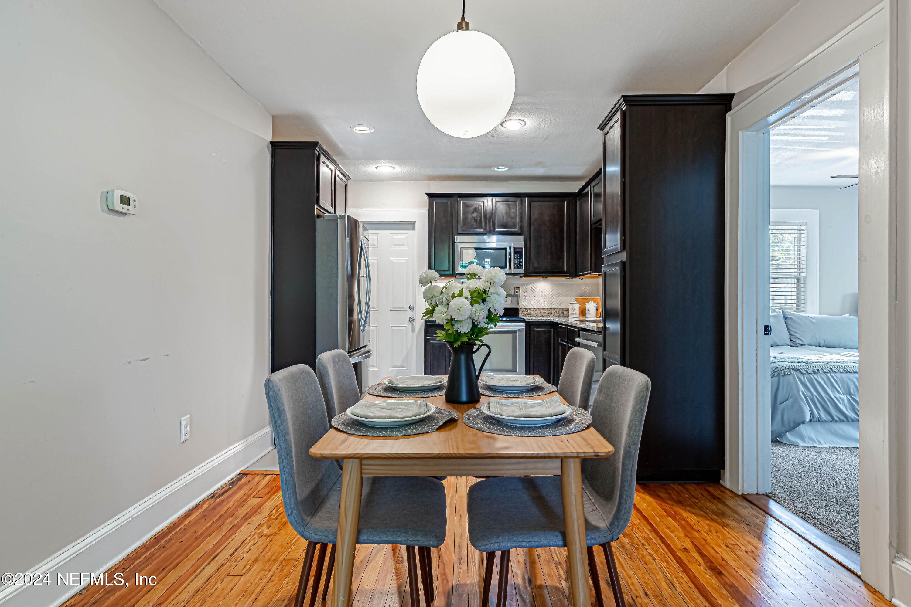 725 Cherokee Street Jacksonville, FL 32205 - Photo 12 of 41 a dining room with furniture and wooden floor