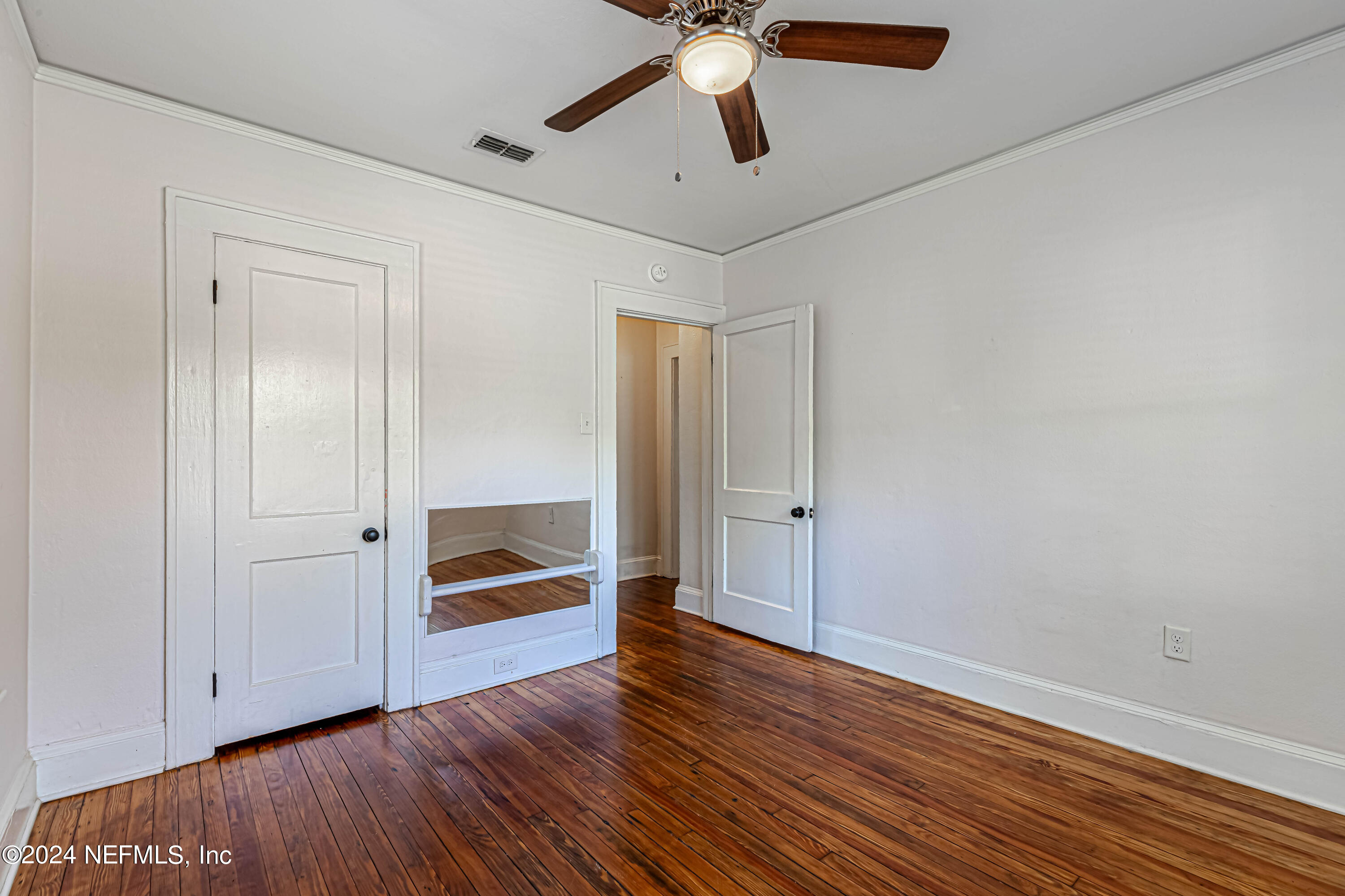725 Cherokee Street Jacksonville, FL 32205 - Photo 21 of 41 a view of an empty room and wooden floor