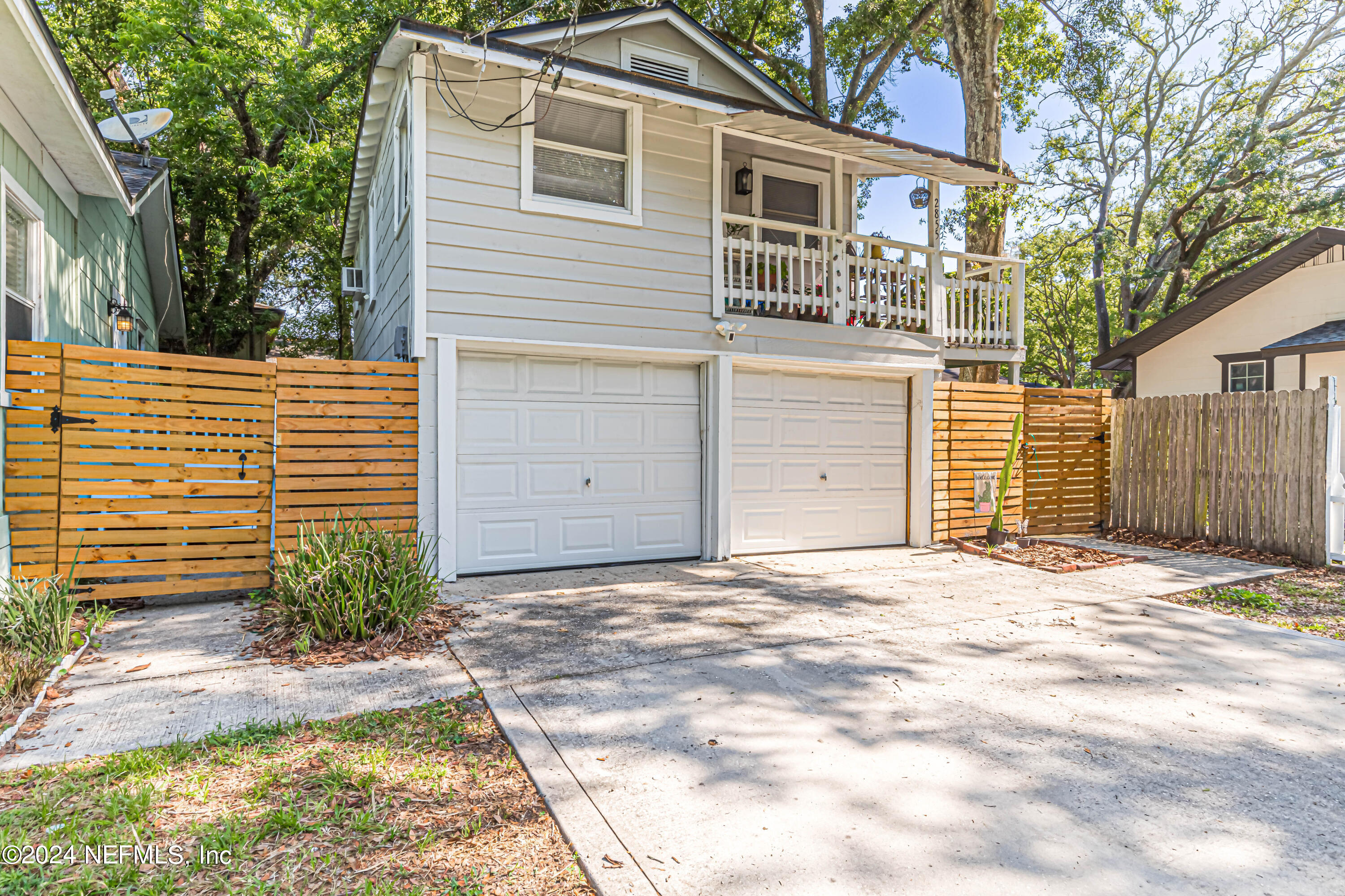 725 Cherokee Street Jacksonville, FL 32205 - Photo 34 of 41 a front view of a house with a yard and garage