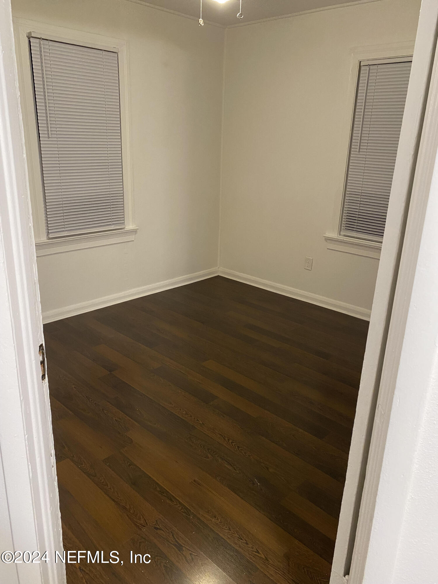 725 Cherokee Street Jacksonville, FL 32205 - Photo 39 of 41 an empty room with wooden floor and sliding door