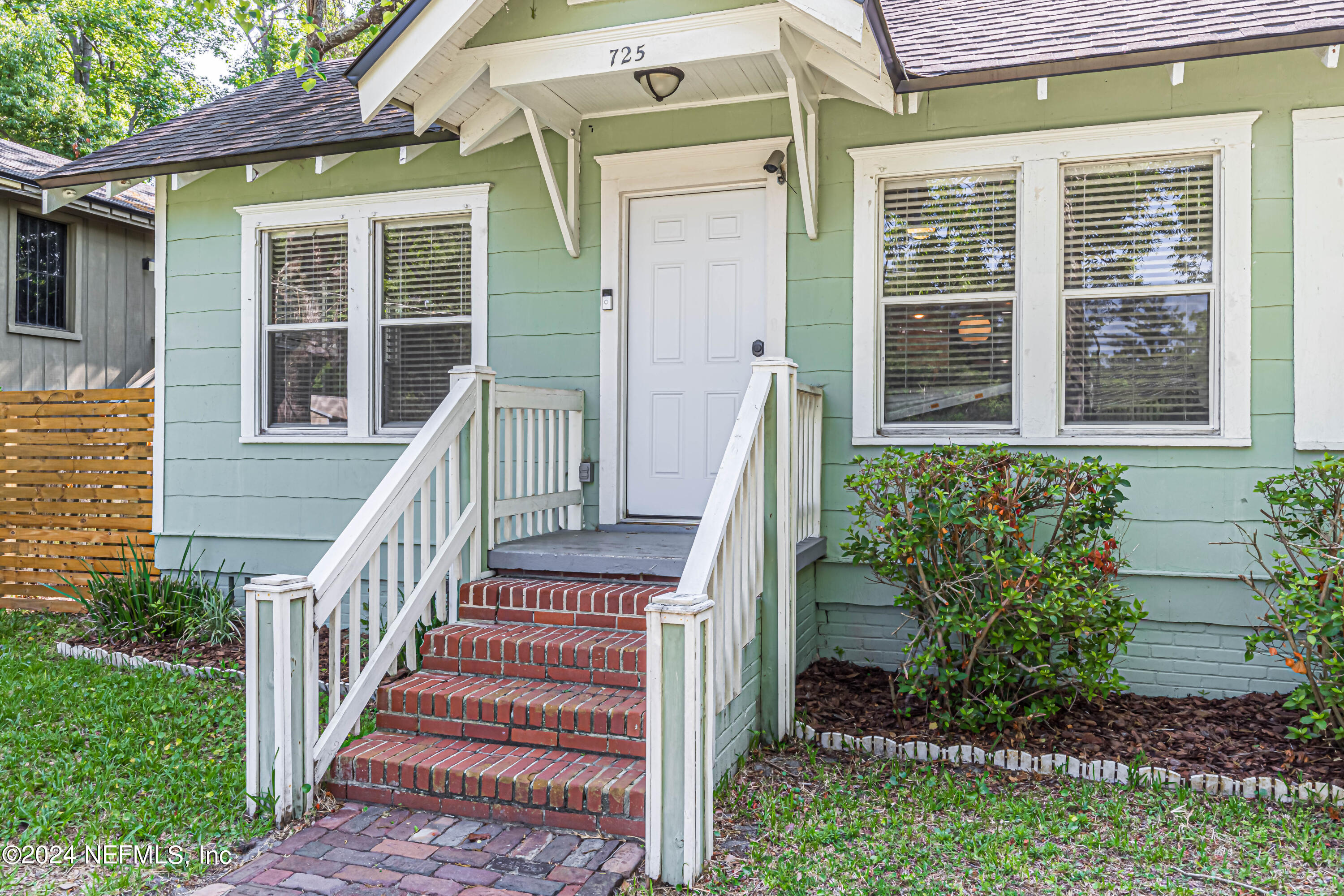 725 Cherokee Street Jacksonville, FL 32205 - Photo 5 of 41 a view of a brick house with a small garden