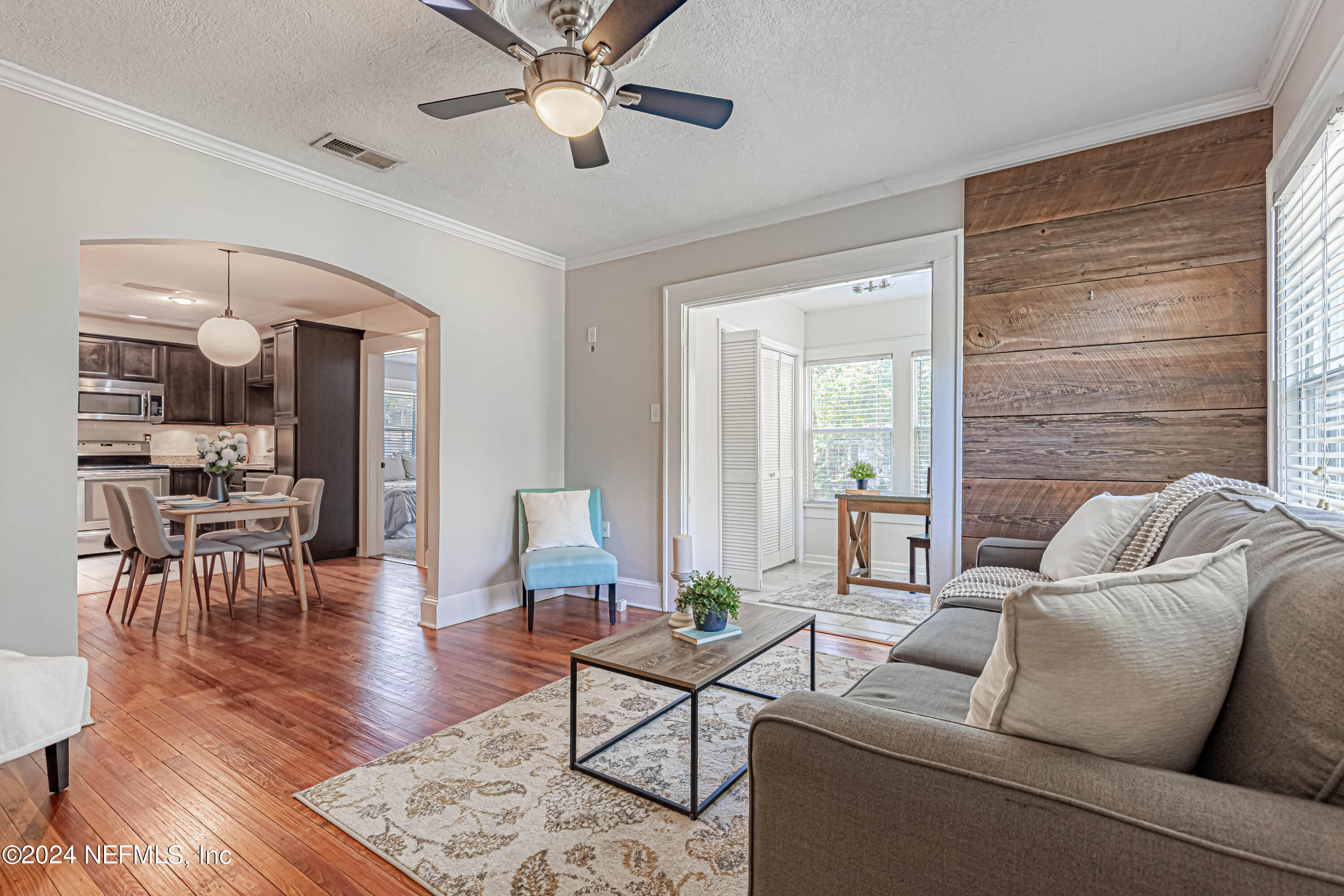 725 Cherokee Street Jacksonville, FL 32205 - Photo 8 of 41 a living room with furniture and a wooden floor