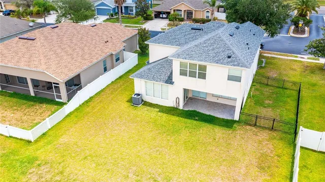 an aerial view of a house with swimming pool
