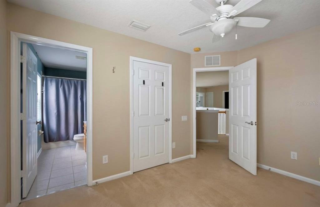 3533 Juneberry Drive Wesley Chapel, FL 33543 - Photo 9 of 12 wooden floor in an empty room and a bathroom