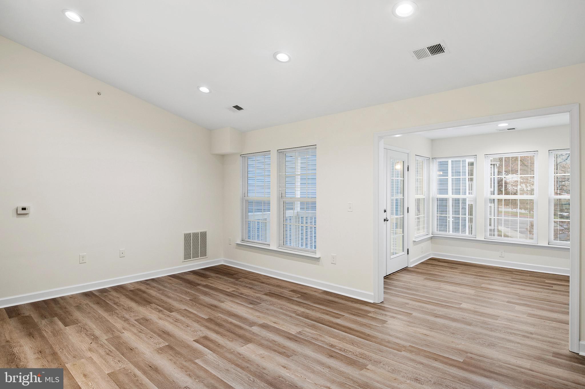6335 Greenfield Road, Unit 1710 Elkridge, MD 21075 - Photo 2 of 20 Foyer View to Living Room and Sunroom
