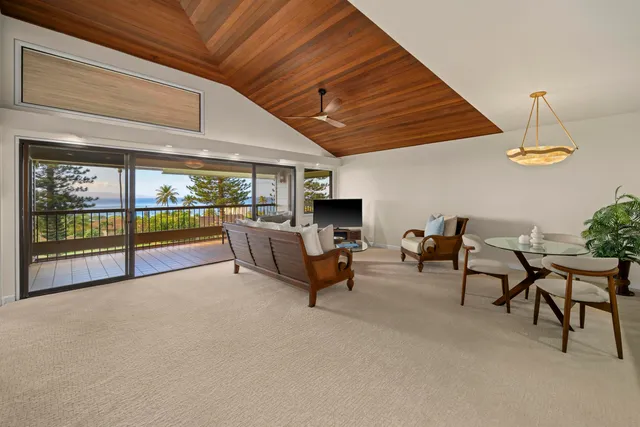 a living room with furniture and a table