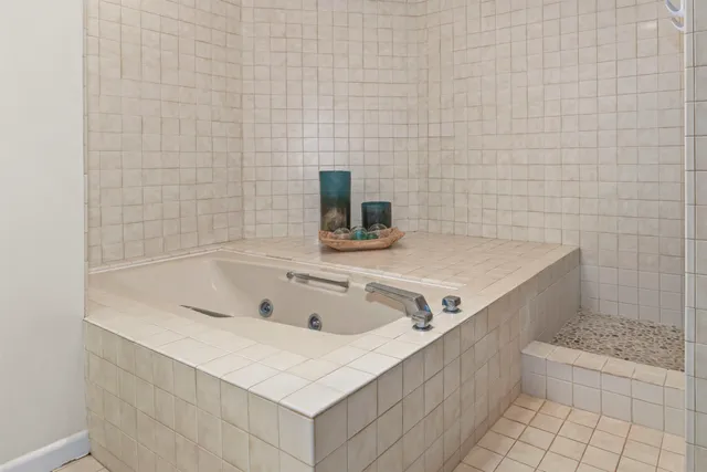 a bathroom with a bathtub and sink