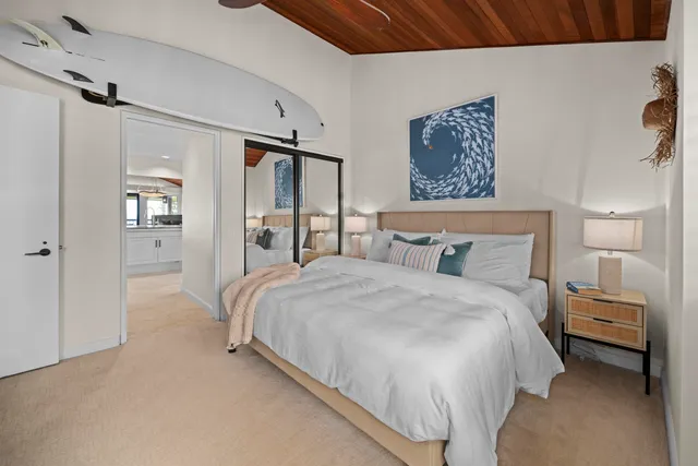 a bedroom with a bed and a walk in closet