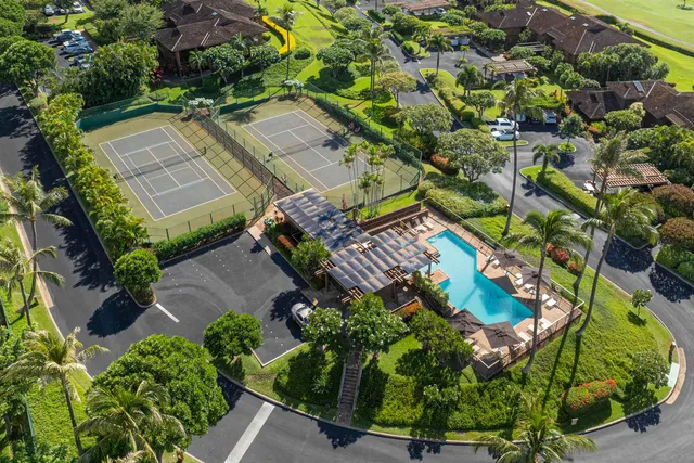 an aerial view of a house with a garden