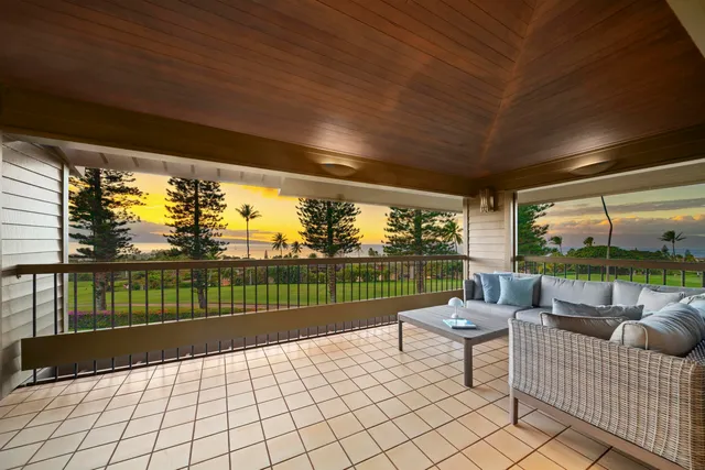 a view of a terrace with couches and pool