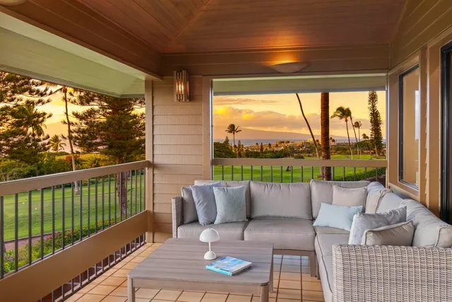 a balcony with furniture and a garden