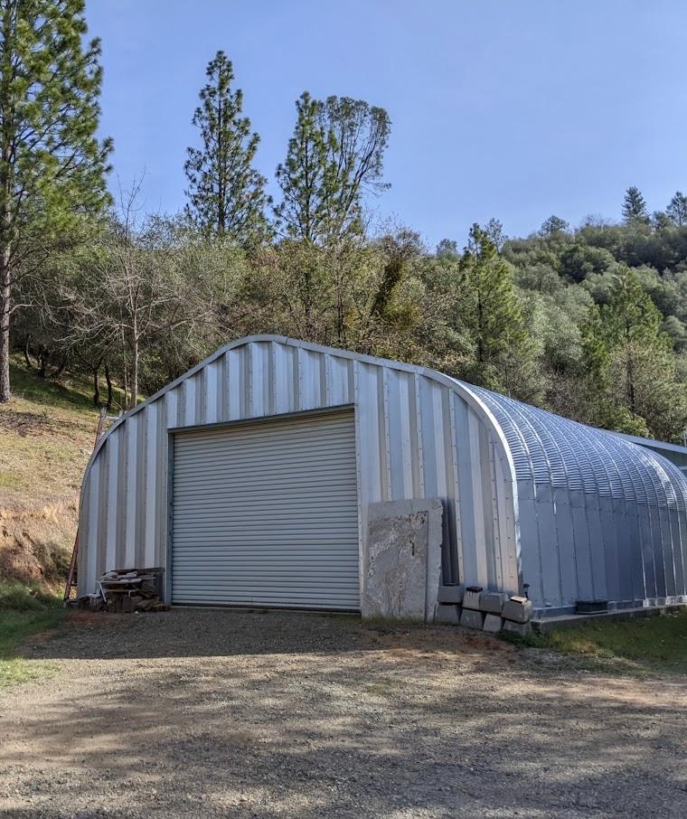 10180 Rock Creek Road Placerville, CA 95667 - Photo 1 of 51 a view of a small barn in the middle of a yard