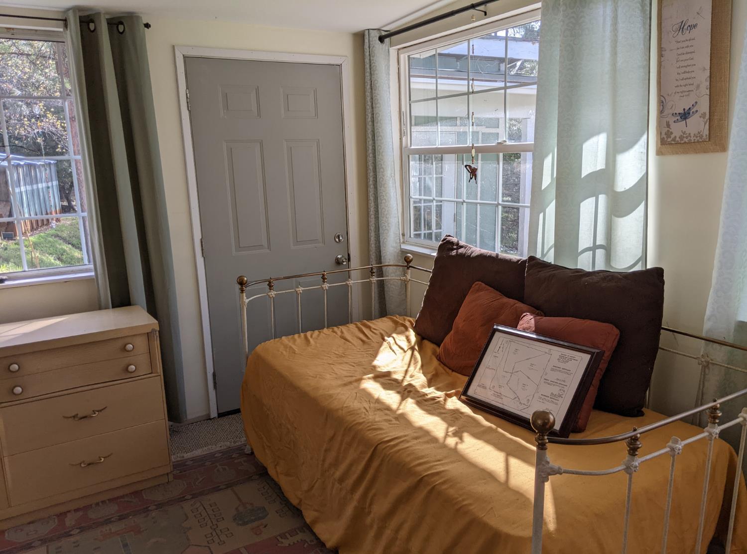 10180 Rock Creek Road Placerville, CA 95667 - Photo 14 of 51 a bed sitting in a bedroom next to a window