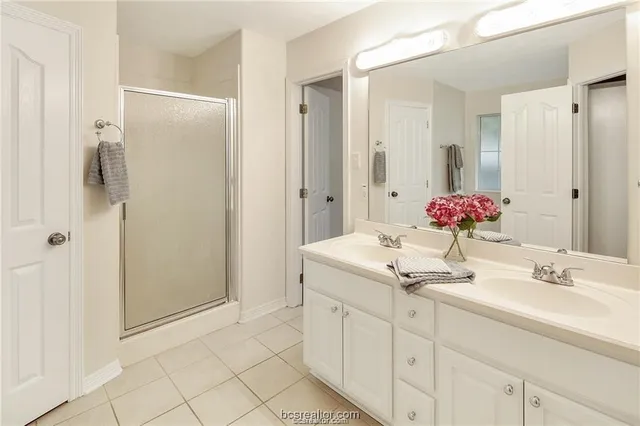 a bathroom with a tub and shower