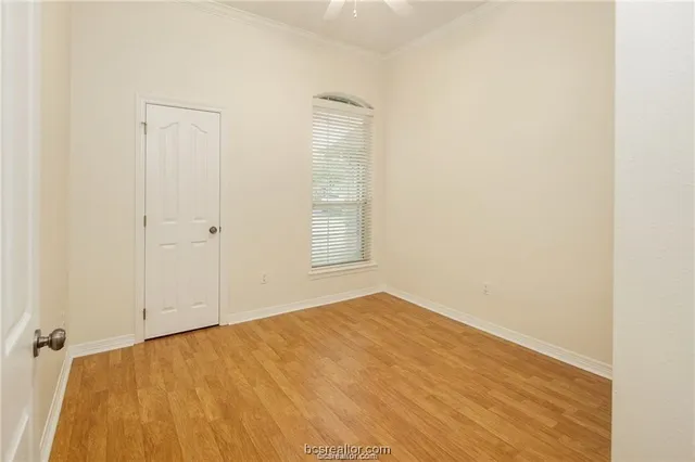 a view of a yard with wooden fence