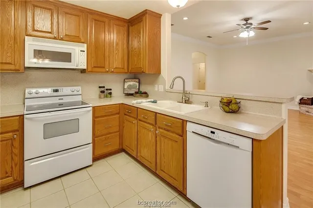 a view of an empty room with a window and closet area