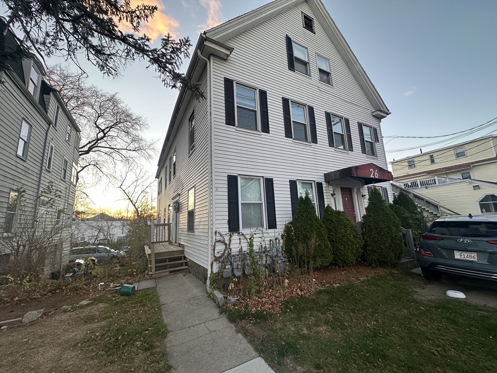 26 North Main Street, Unit 4 Natick, MA 01760 - Photo 1 of 13 a front view of a house with a yard