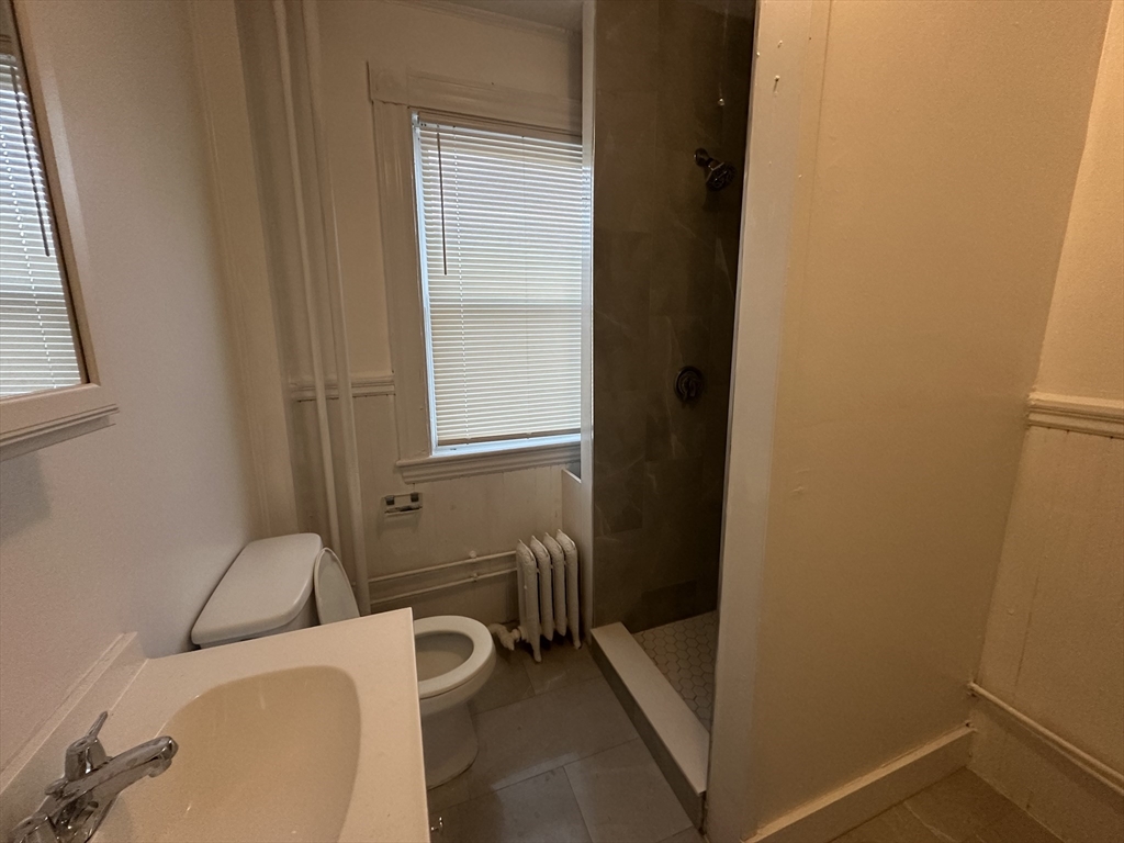 26 North Main Street, Unit 4 Natick, MA 01760 - Photo 8 of 13 a bathroom with a toilet and a sink