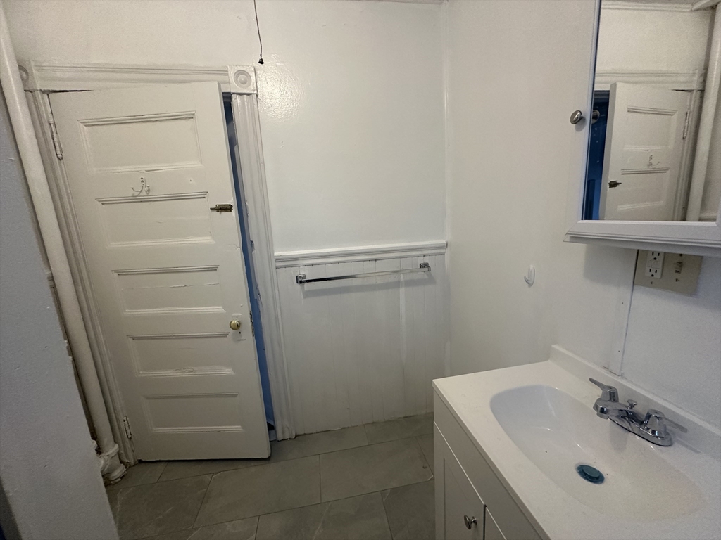 26 North Main Street, Unit 4 Natick, MA 01760 - Photo 9 of 13 a bathroom with a sink and a mirror