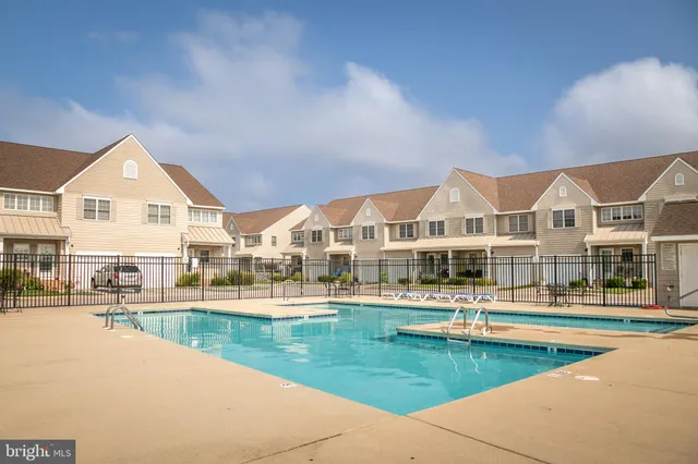 a kitchen with stainless steel appliances granite countertop a stove microwave and sink