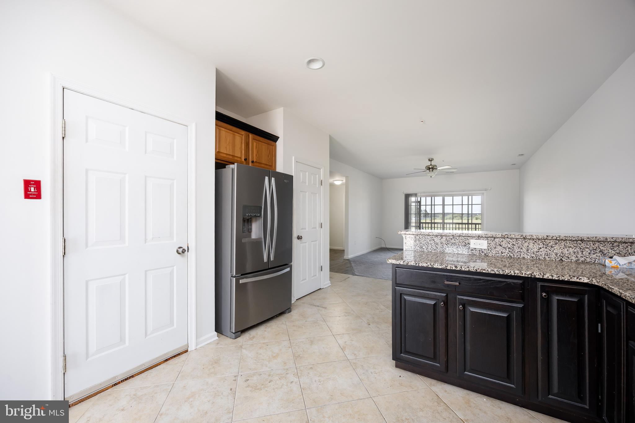 111 Sunset Circle, Unit 111E Crisfield, MD 21817 - Photo 22 of 57 a kitchen with stainless steel appliances granite countertop a refrigerator and a sink