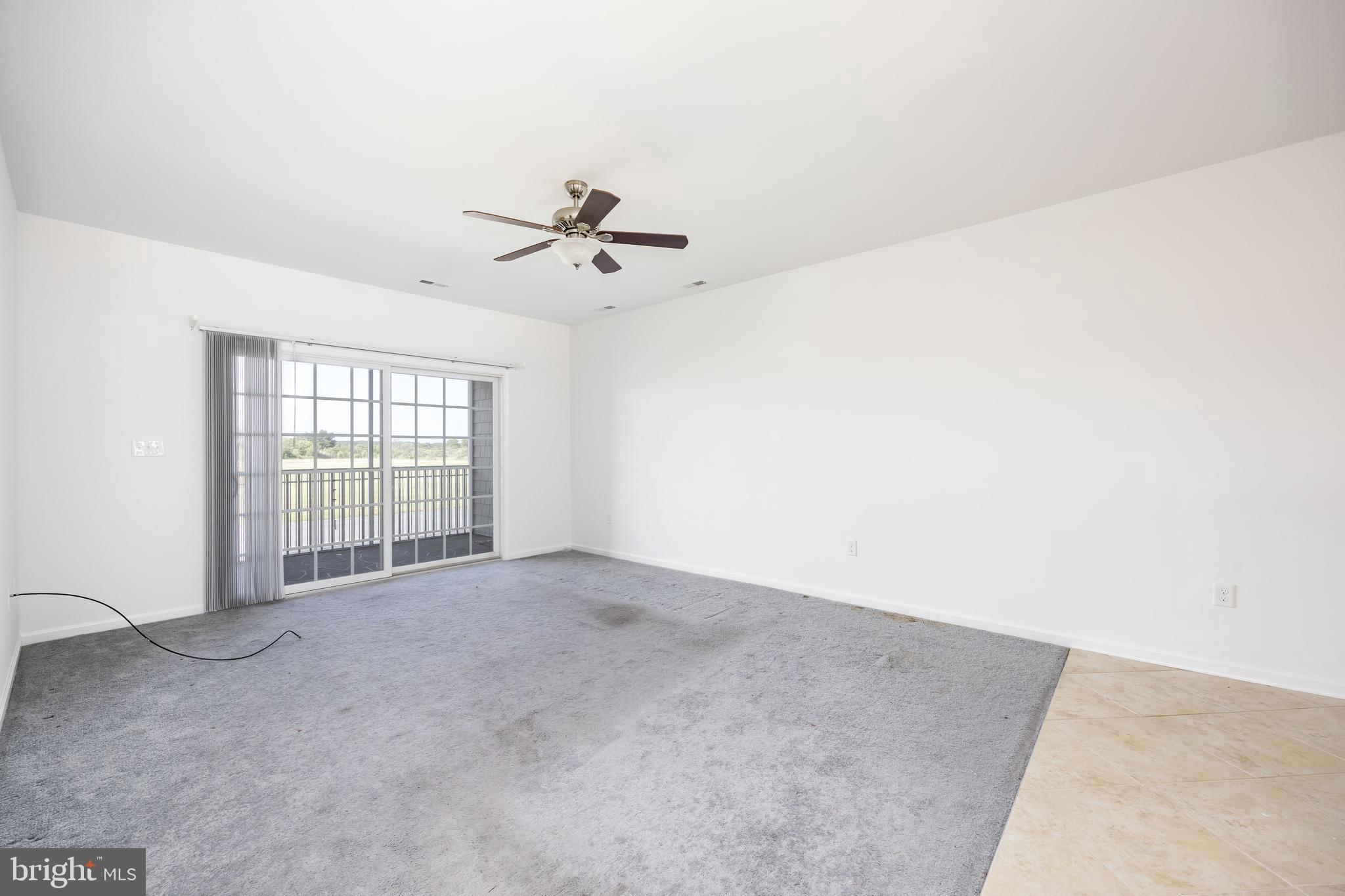 111 Sunset Circle, Unit 111E Crisfield, MD 21817 - Photo 26 of 57 a view of an empty room with a window