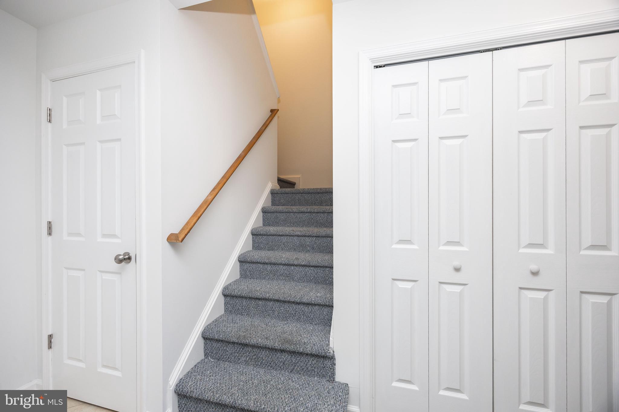 111 Sunset Circle, Unit 111E Crisfield, MD 21817 - Photo 29 of 57 a view of a hallway with wooden floor and entryway