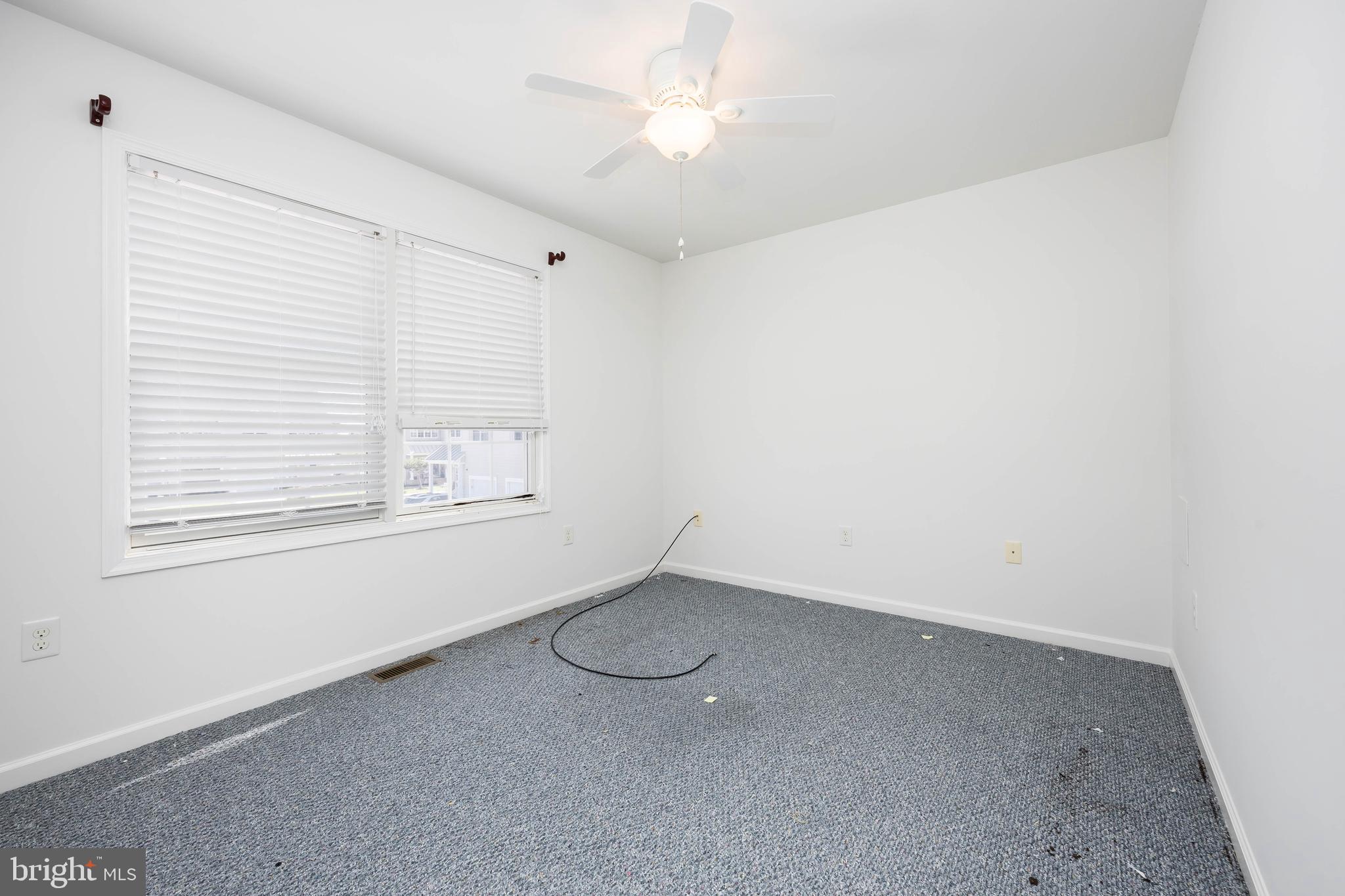 111 Sunset Circle, Unit 111E Crisfield, MD 21817 - Photo 36 of 57 an empty room with a window
