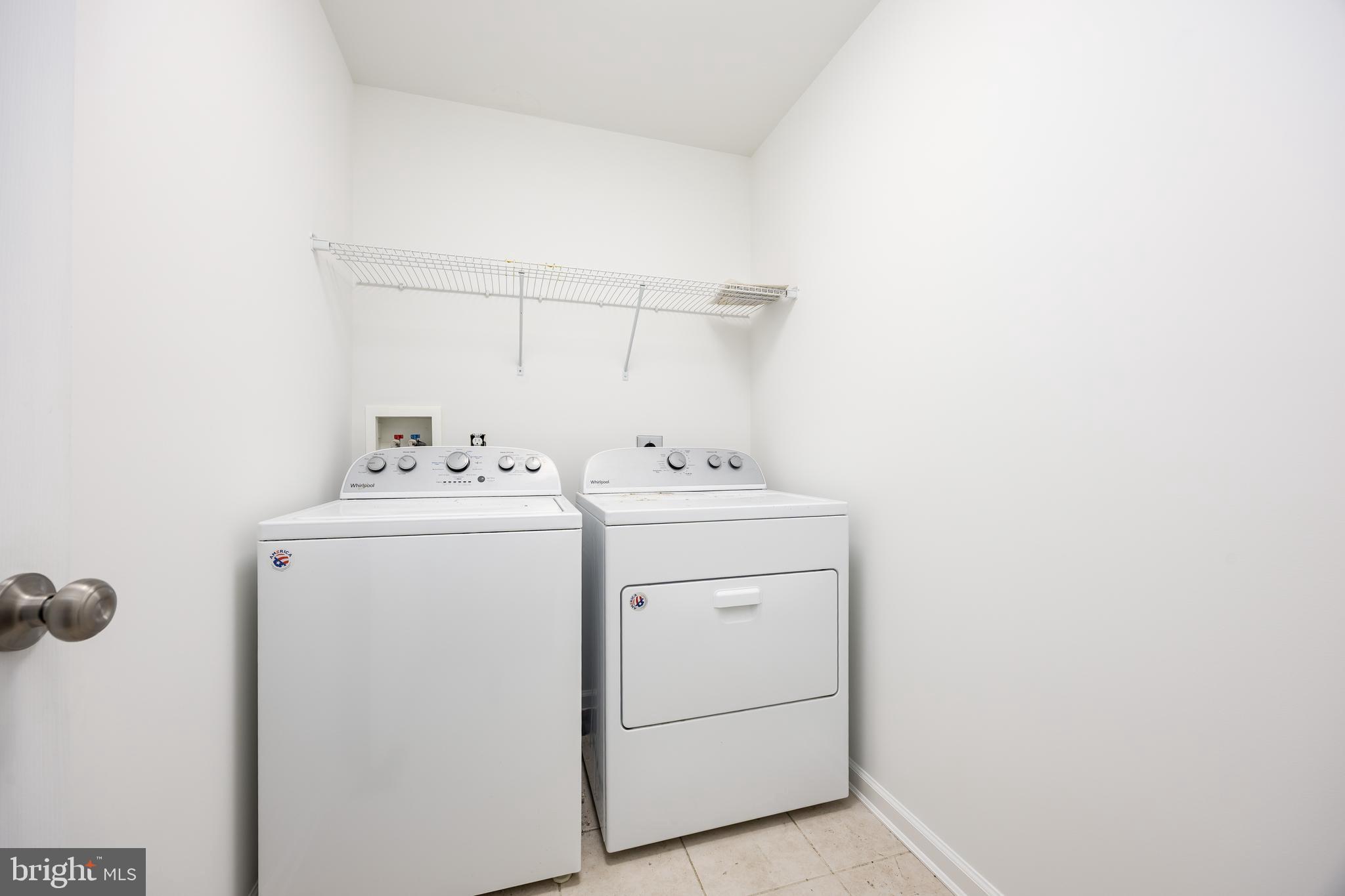 111 Sunset Circle, Unit 111E Crisfield, MD 21817 - Photo 40 of 57 a utility room with dryer and washer