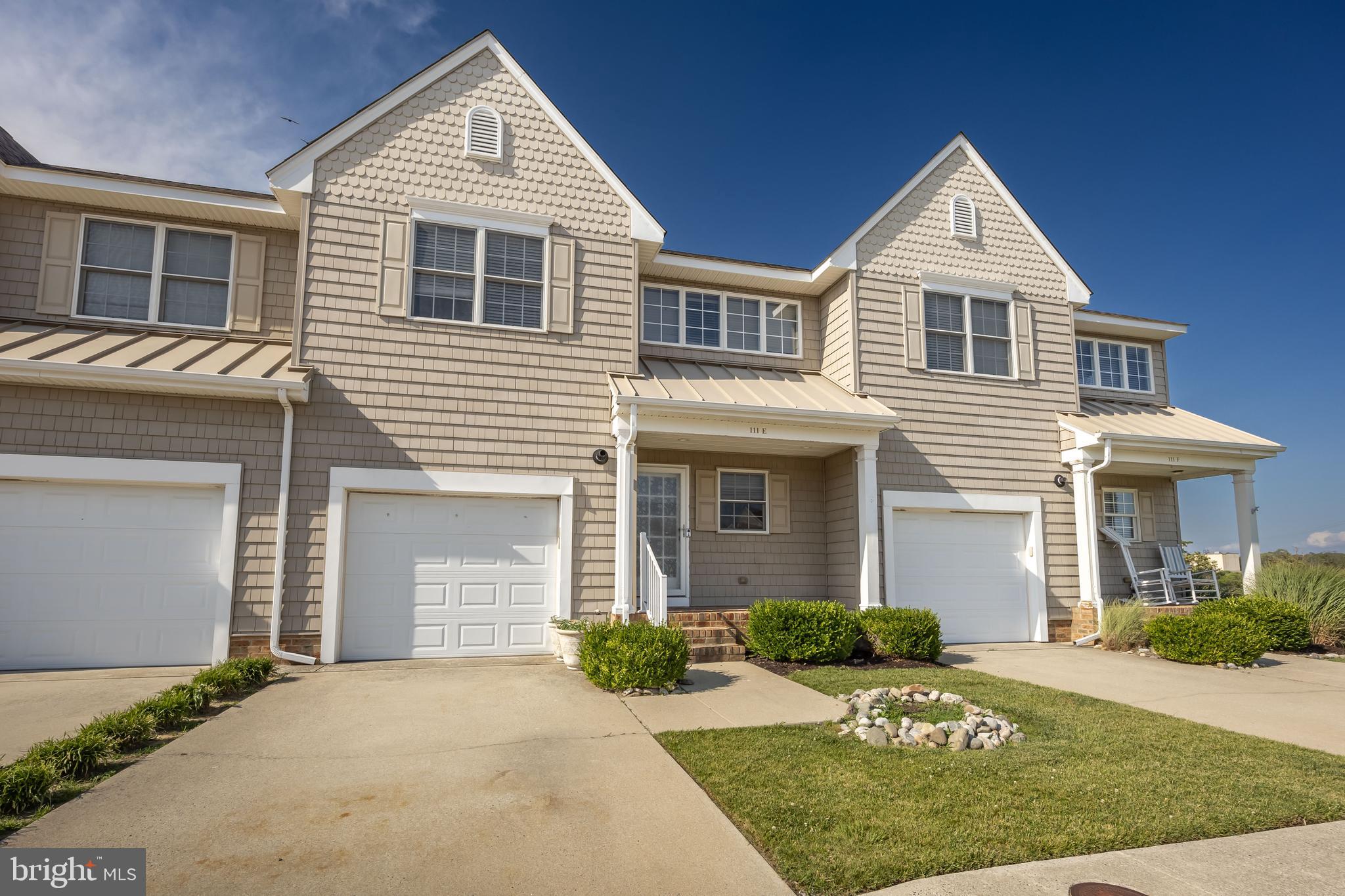 111 Sunset Circle, Unit 111E Crisfield, MD 21817 - Photo 57 of 57 a front view of a house with a yard