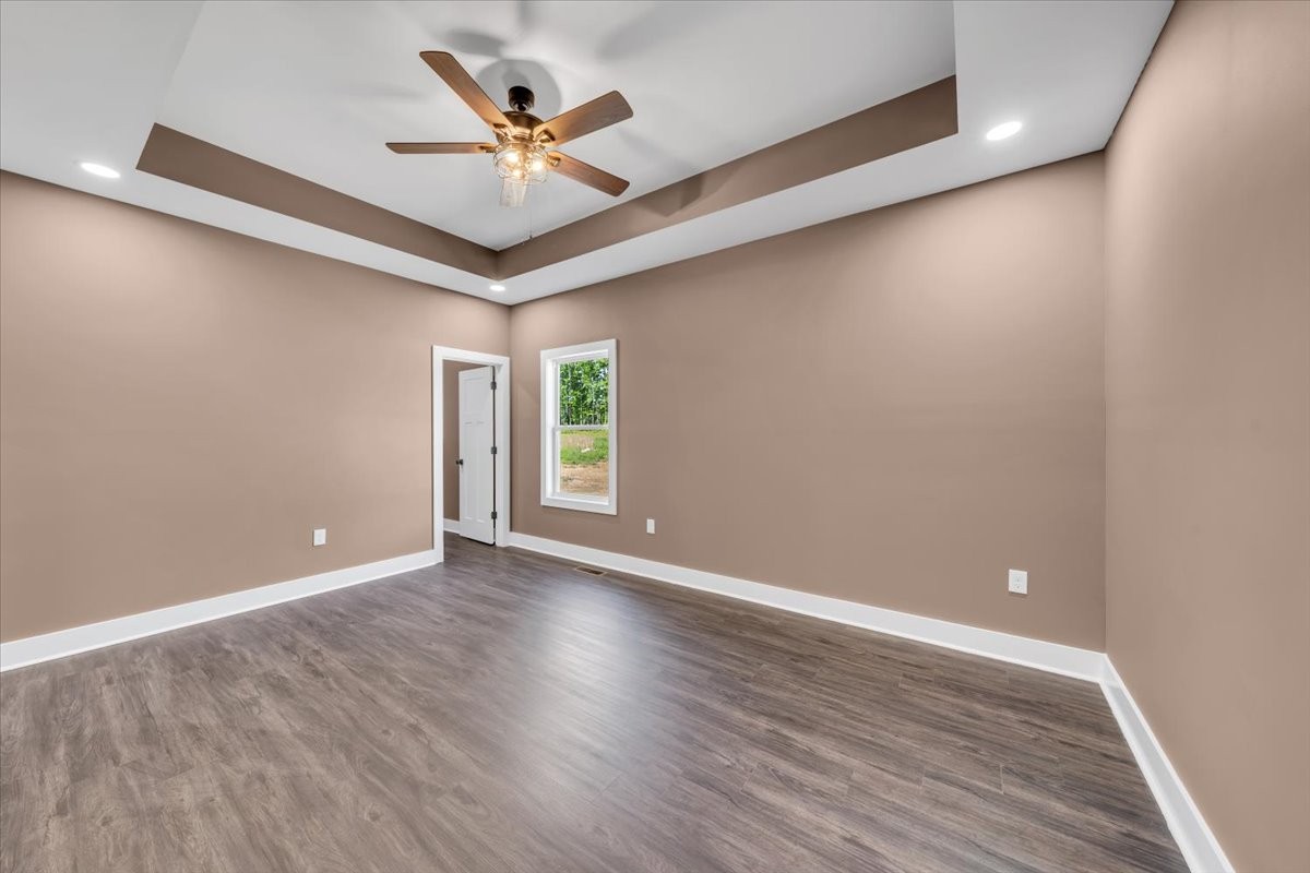 71 Brinkley Road Wartrace, TN 37183 - Photo 14 of 42 an empty room with wooden floor and ceiling fan