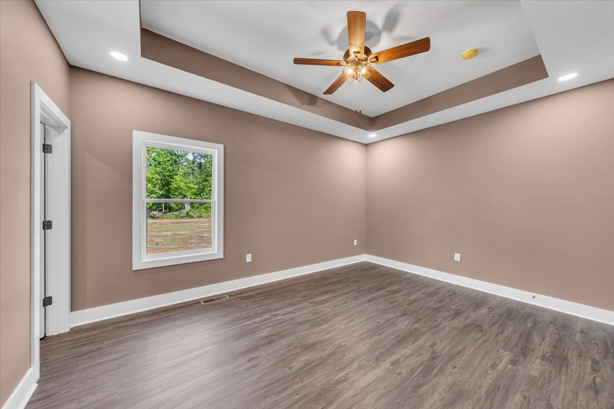 71 Brinkley Road Wartrace, TN 37183 - Photo 17 of 42 an empty room with windows and a ceiling fan