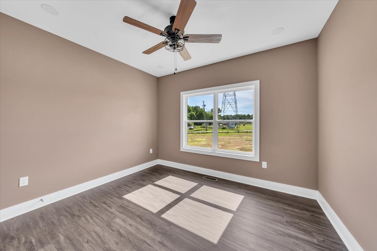 71 Brinkley Road Wartrace, TN 37183 - Photo 24 of 42 an empty room with wooden floor and windows