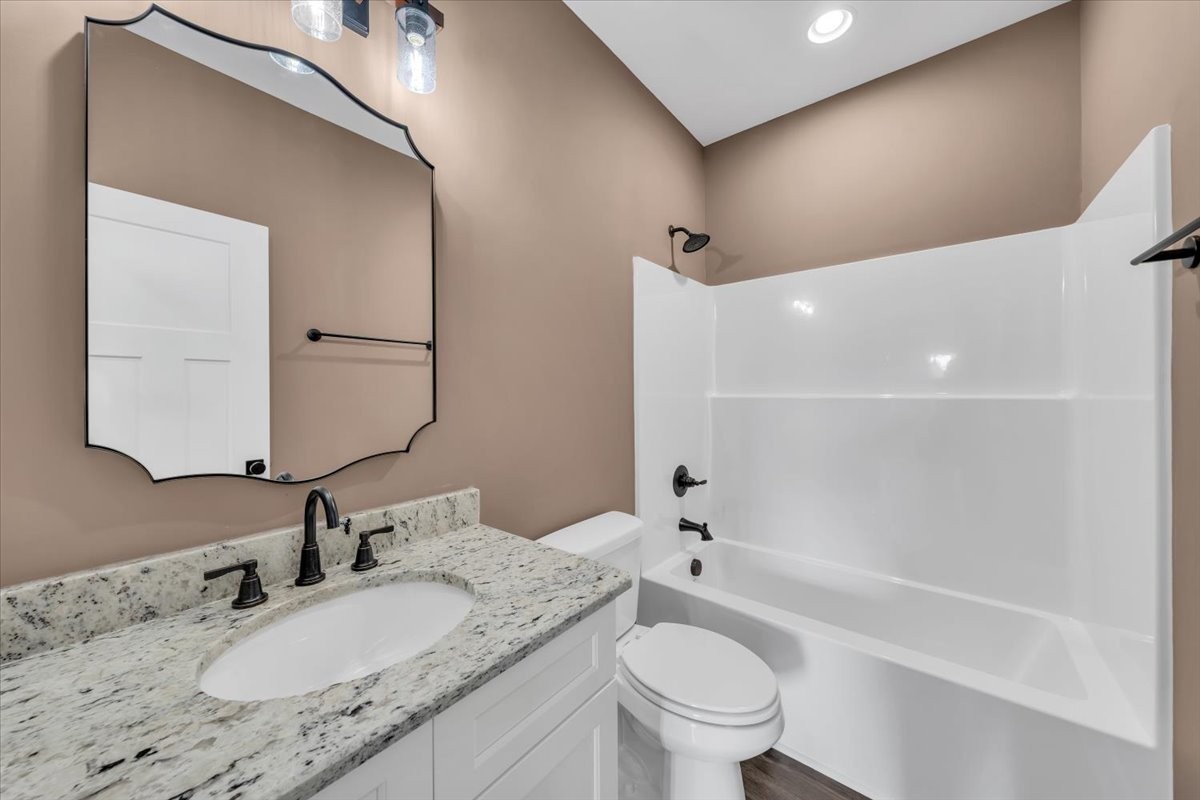 71 Brinkley Road Wartrace, TN 37183 - Photo 25 of 42 a bathroom with a granite countertop sink a toilet and bathtub