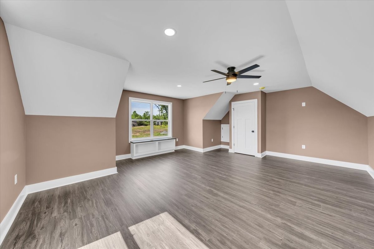 71 Brinkley Road Wartrace, TN 37183 - Photo 29 of 42 an empty room with wooden floor chandelier fan and windows