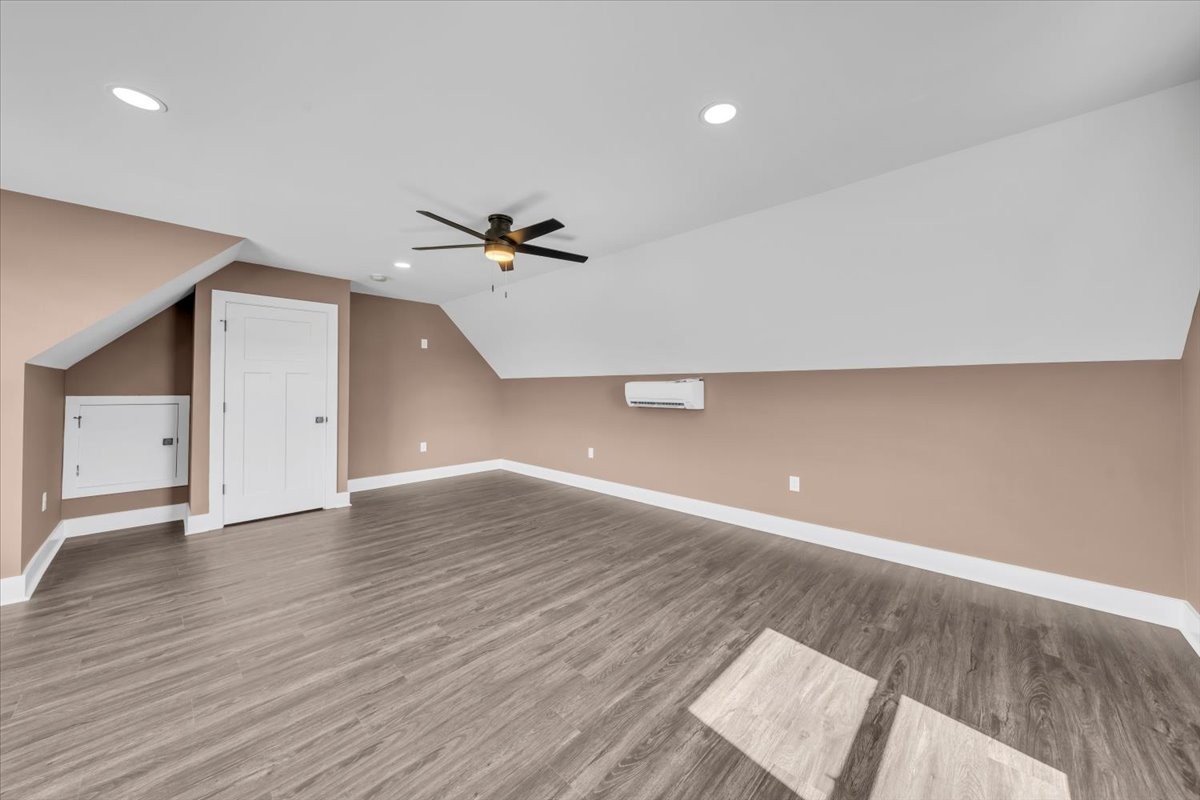 71 Brinkley Road Wartrace, TN 37183 - Photo 30 of 42 a view of an empty room with a window and wooden floor