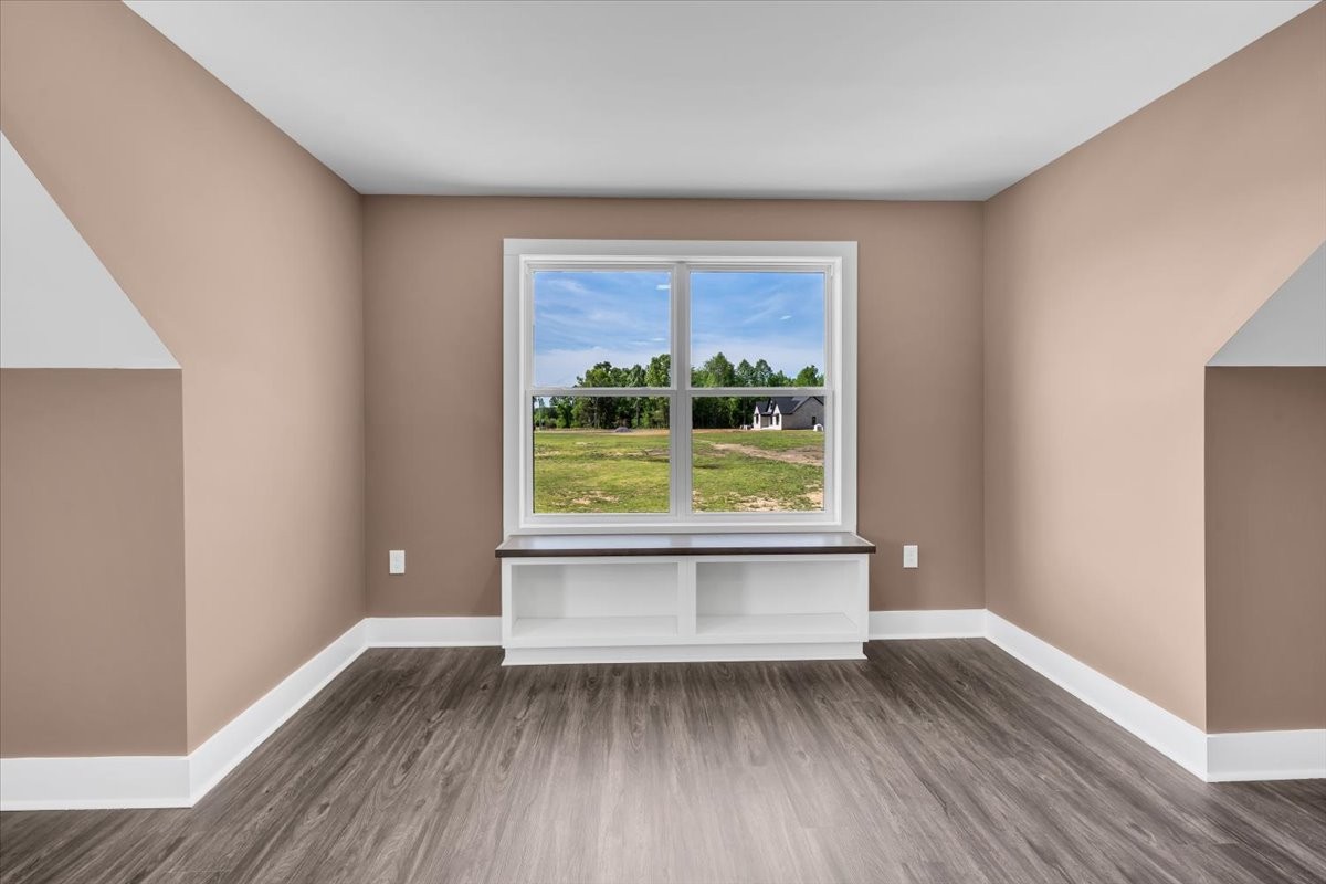 71 Brinkley Road Wartrace, TN 37183 - Photo 31 of 42 a view of an empty room with wooden floor and a window