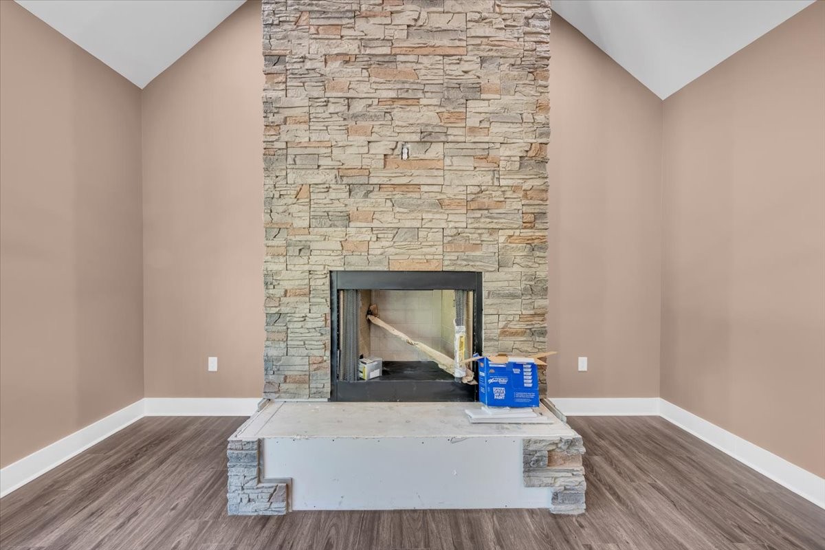 71 Brinkley Road Wartrace, TN 37183 - Photo 4 of 42 a living room with a wooden floor and a fireplace