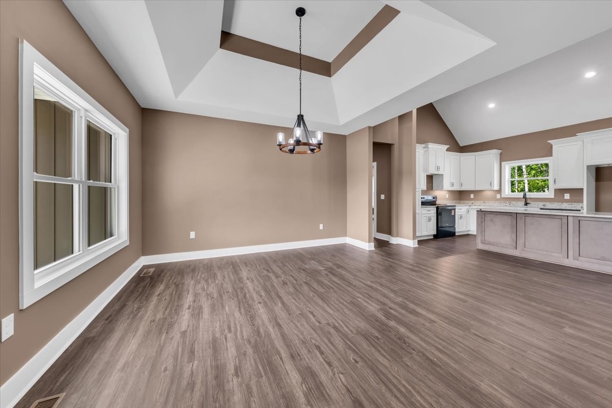 71 Brinkley Road Wartrace, TN 37183 - Photo 7 of 42 a view of a kitchen with wooden floor and a ceiling fan