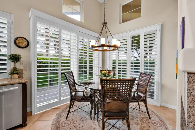 a view of a dining room with furniture and window