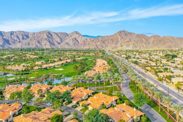 a view of a city with mountains in the background