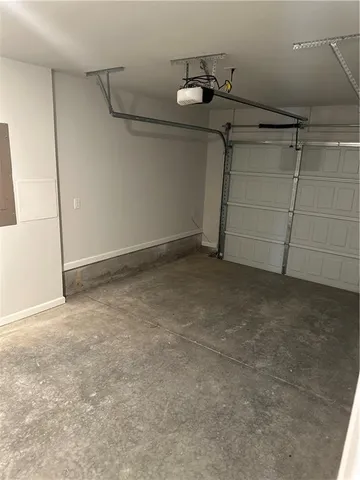 a view of a room with a floor to ceiling window and a yard