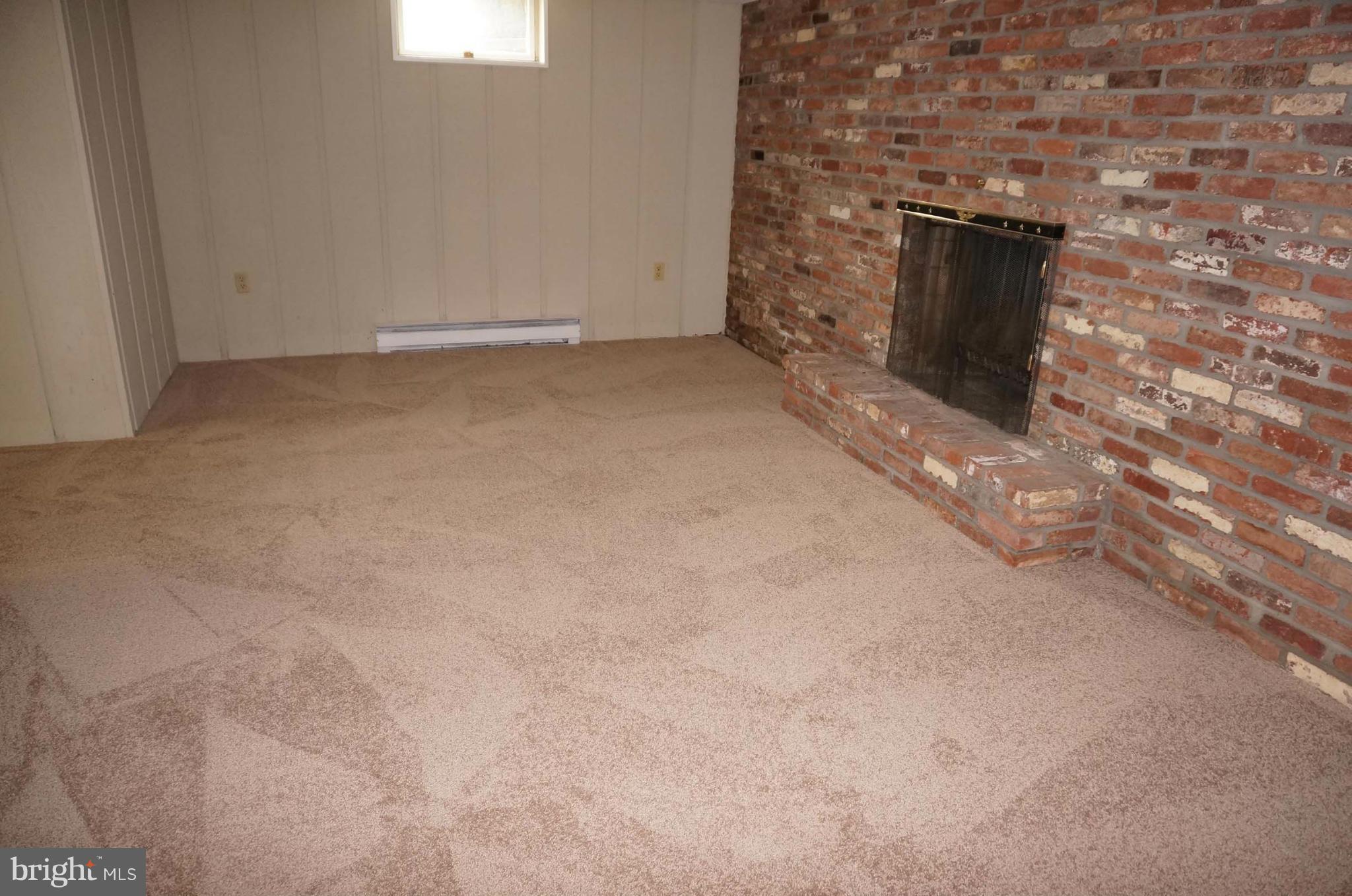 7932 Edgewood Farm Road Frederick, MD 21702 - Photo 22 of 30 Basement with Fireplace