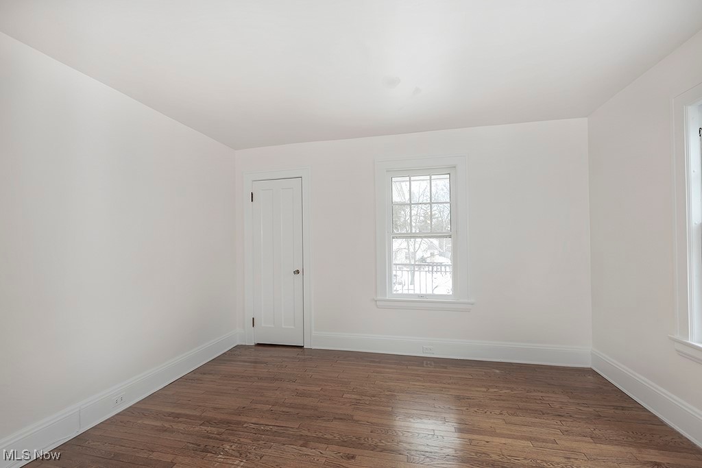 2596 Ashton Road Cleveland, OH 44118 - Photo 28 of 43 Unfurnished room with dark wood-type flooring