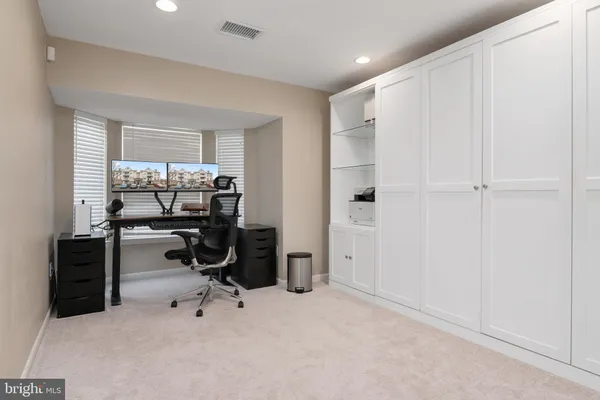 a view of a workspace with furniture