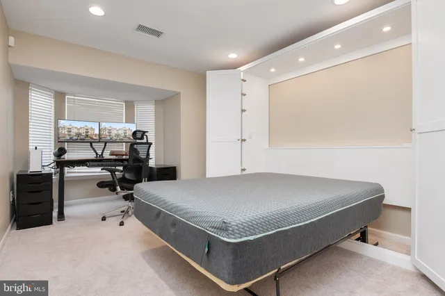 a bed room with a bed and furniture