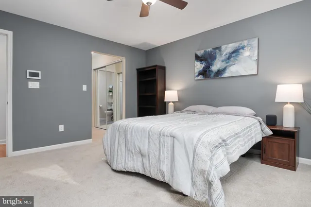 a bedroom with a bed and lamp