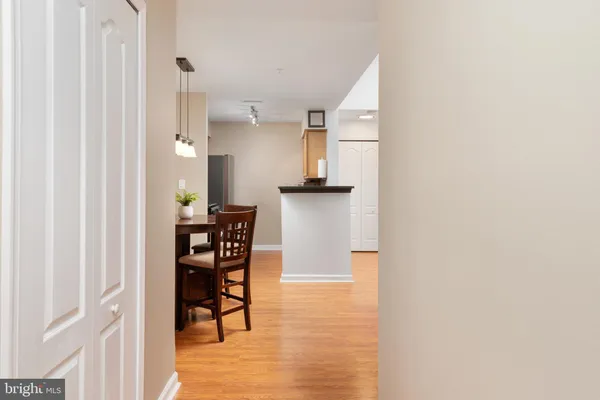 a dining room with furniture and wooden floor