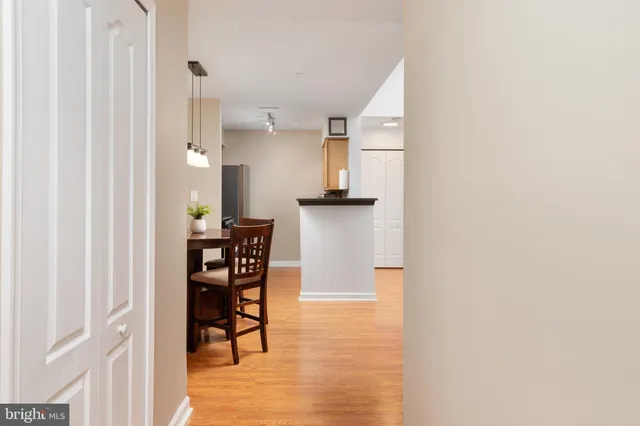a dining room with furniture and wooden floor